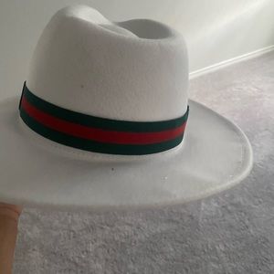 White with green and red stripes Fedora hat….